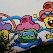 Os bolinhos da Maria Raquel Bolinho, pintados na parede de uma escola de natação na avenida Bandeirantes. Fotografado por Beto Trajano em 7.4.2014